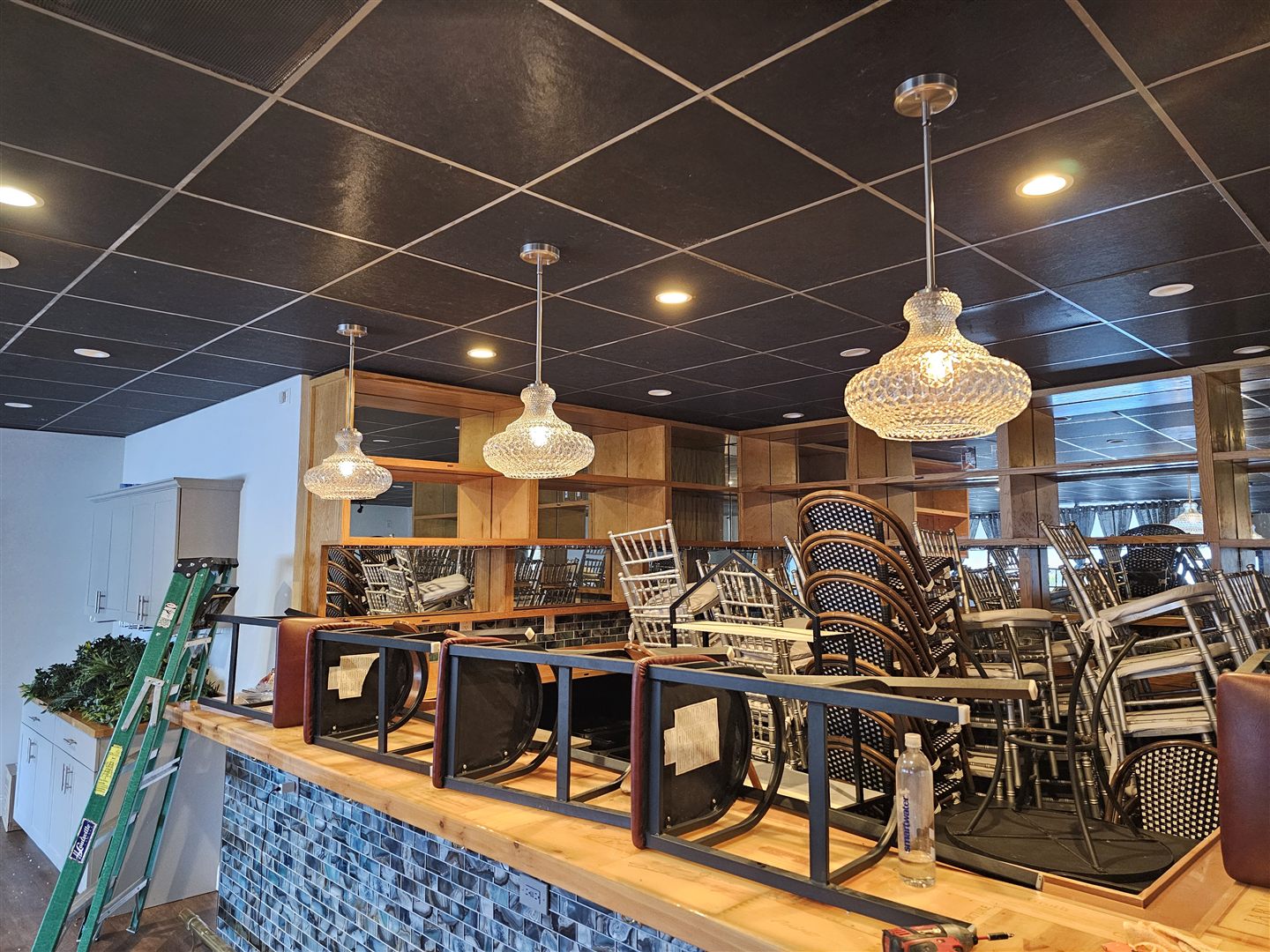 Pendant lighting and fans in a commercial dining space