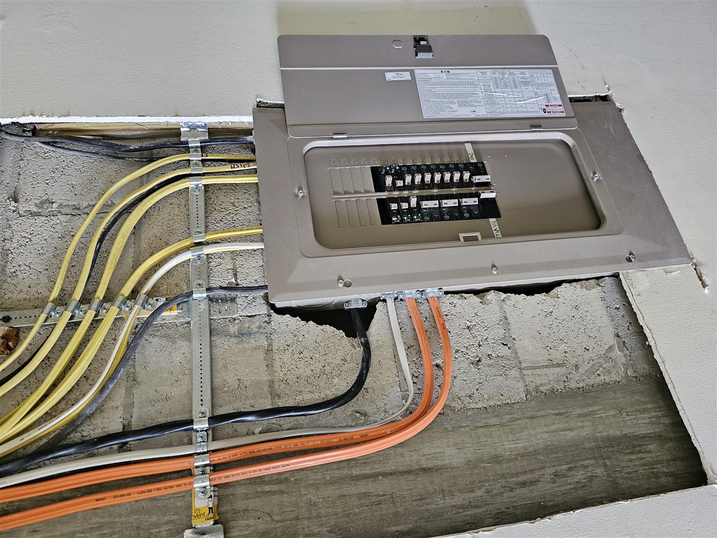 Electrical panel with neatly arranged conduit and wiring